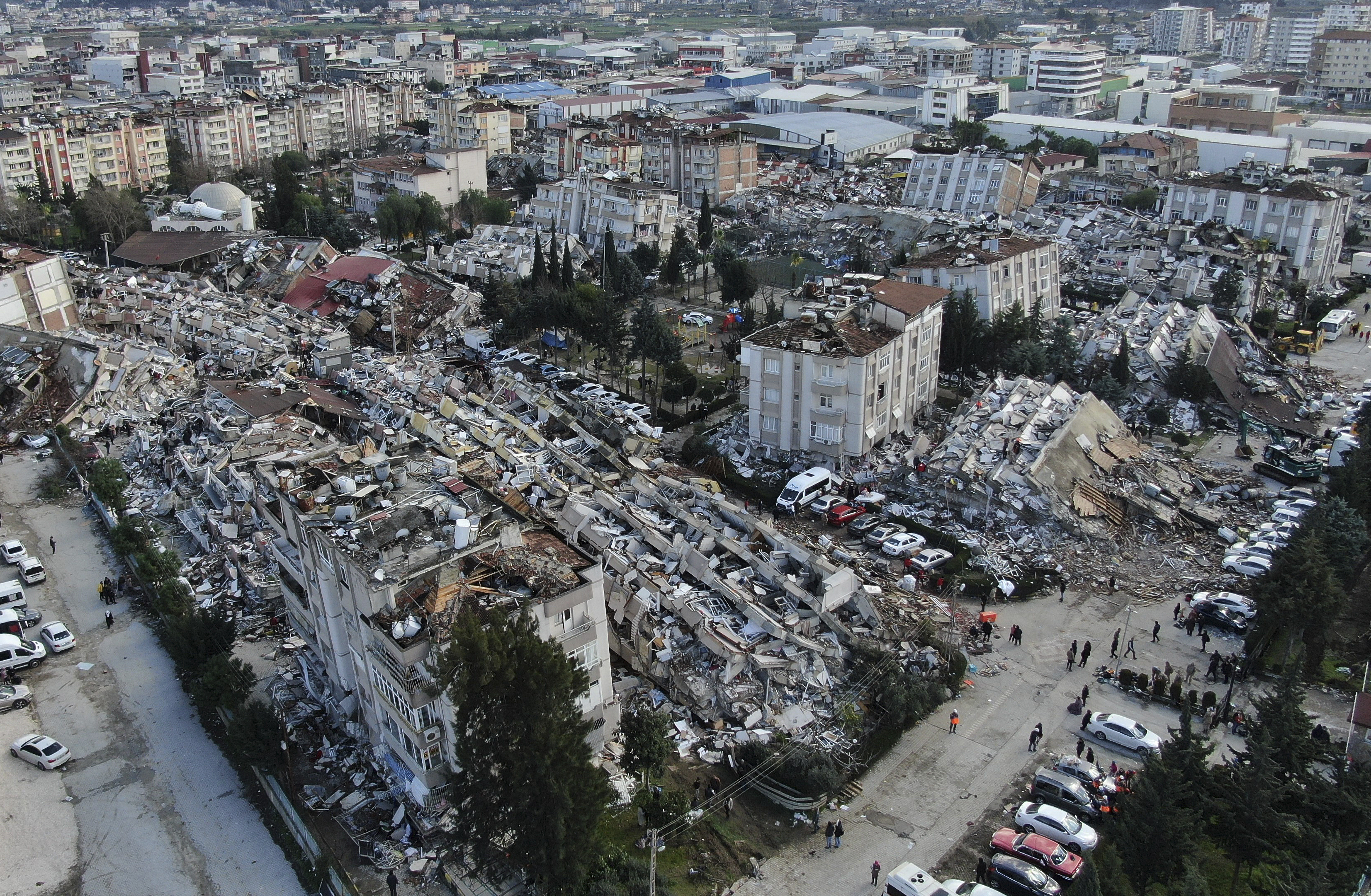 Aerial photo shows the destruction in Hatay city center, southern Turkey, Tuesday, Feb. 7, 2023. Search teams and emergency aid from around the world poured into Turkey and Syria on Tuesday as rescuers working in freezing temperatures dug — sometimes with their bare hands — through the remains of buildings flattened by a magnitude 7.8 earthquake. The death toll soared above 5,000 and was still expected to rise. of collapsed buildings across the region. (IHA via AP)