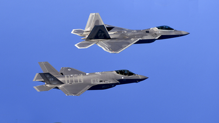 141105-F-XC395-173F-22 Raptors from the 94th Fighter Squadron, Joint Base Langley-Eustis, Va. and F-35 Lightening IIs from the 58th Fighter Squadron, Eglin Air Force Base, Fla. fly in formation over the Eglin Training Range after completing an integration training mission Nov. 5, 2014.  F-35s and F-22 Raptors integrated throughout four missions to fight against T-38 Talons to improve employment of fifth generation aircraft. (U.S. Air Force photo/Master Sgt. Shane A. Cuomo)