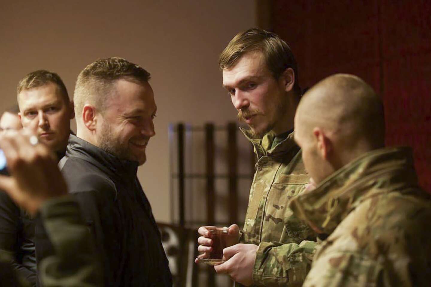 FILE - Ukrainian Interior Minister Denys Monastyrsky, second left, talks with Azov regiment commander Denys Prokopenko, second right, who was released in a prisoner exchange between Russia and Ukraine, in Chernyhiv, Ukraine, late Wednesday, Sept. 21, 2022. Ukraine announced a high-profile prisoner swap early Thursday, Sept. 22, 2022 that was the culmination of months of efforts to free many of the Ukrainian fighters who defended a steel plant in Mariupol during a long Russian siege. In exchange, Ukraine gave up a prominent ally of Russian President Vladimir Putin and 55 other prisoners. (Ukrainian Interior Ministry Press Office via AP, File)