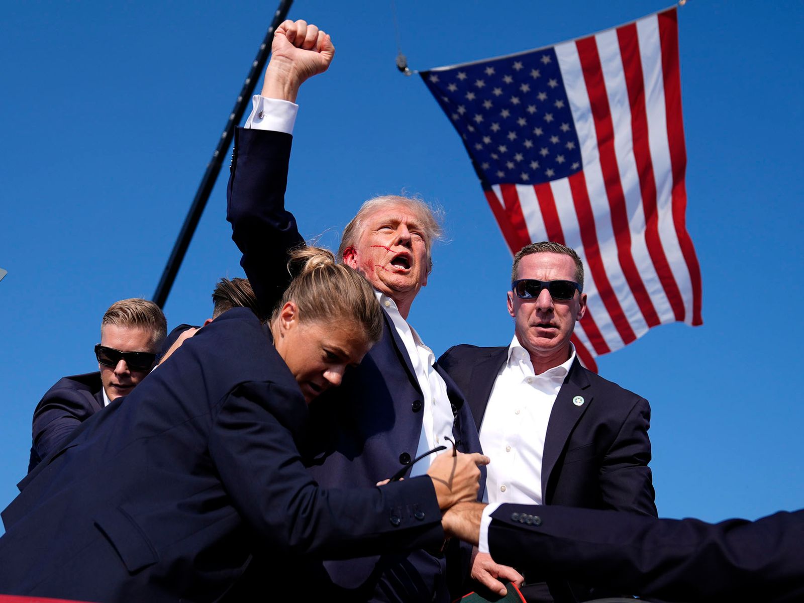 Republican presidential candidate former President Donald Trump is surrounded by U.S. Secret Service agents at a campaign rally, Saturday, July 13, 2024, in Butler, Pa. (AP Photo/Evan Vucci)