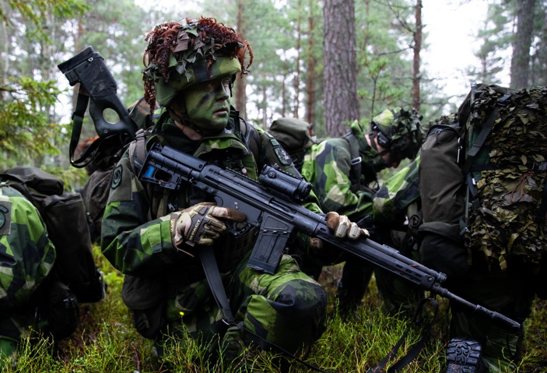 Soldiers from the Swedish Home Guard secure an area during a patrol as part of a bilateral exercise in Sweden, November 26, 2020. The Home Guard is part of the Swedish Armed Forces and comprises nearly half of the Swedish Armed Forces’ body of personnel who are designed to operate across the entire conflict scale from providing peacetime assistance to society in times of crisis, to armed struggle in wartime. (U.S Army photo by Sgt. Patrik Orcutt)