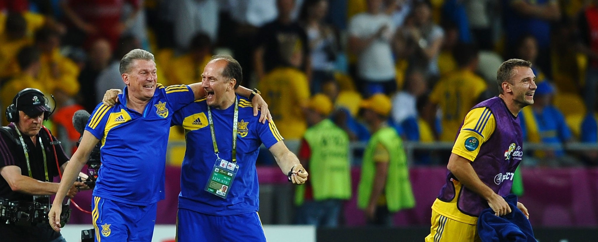 KIEV, UKRAINE - JUNE 11:  Head Coach Oleh Blokhin of Ukraine celebrates victory Andriy Shevchenko of Ukraine during the UEFA EURO 2012 group D match between Ukraine and Sweden at The Olympic Stadium on June 11, 2012 in Kiev, Ukraine.  (Photo by Laurence Griffiths/Getty Images)